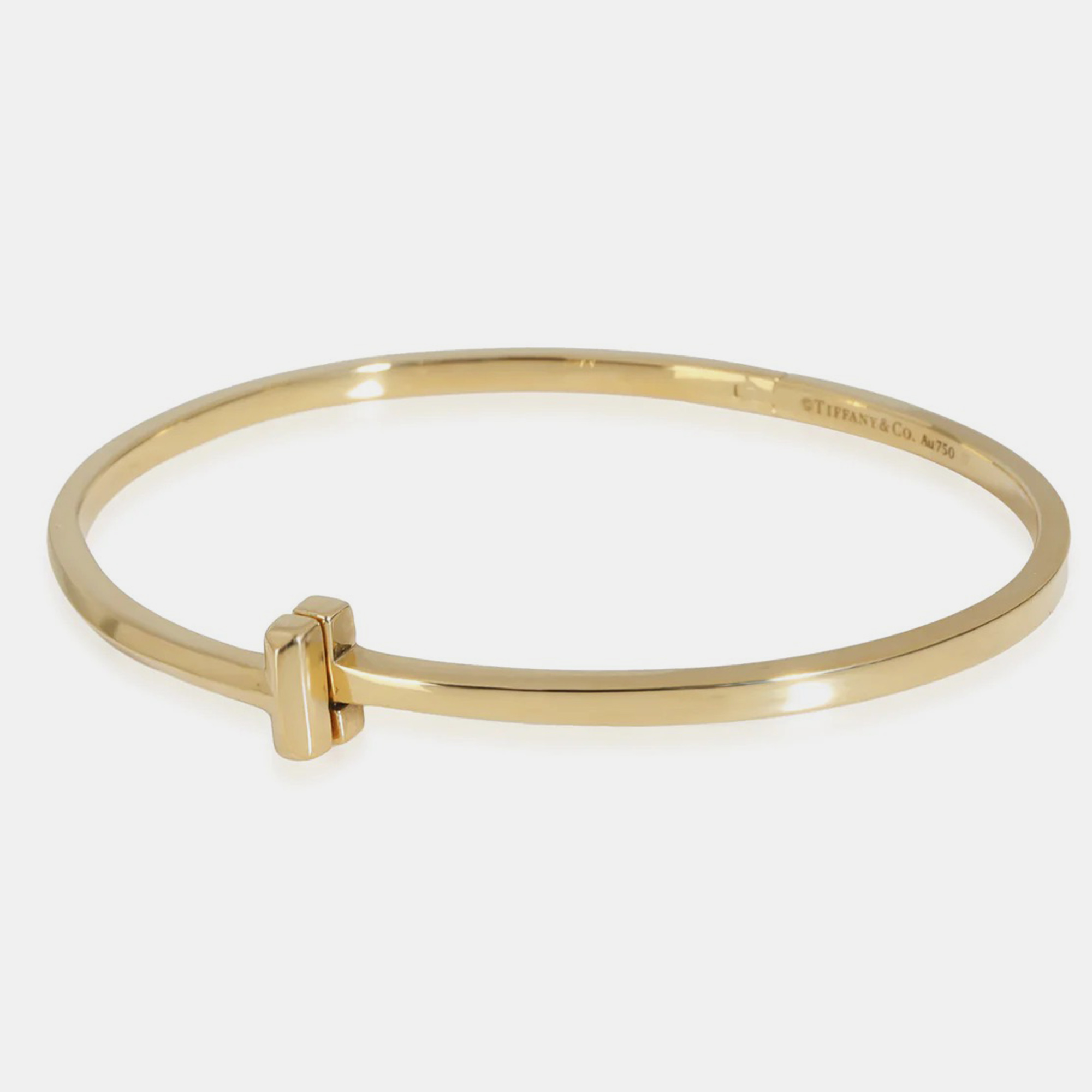 

Tiffany & Co. 18K Yellow Gold T Narrow Hinged Bangle Bracelet