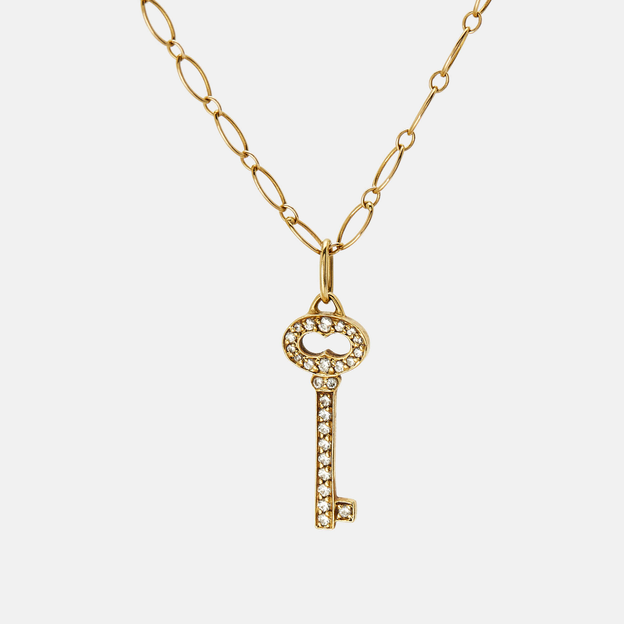 

Tiffany & Co. Vintage Oval Key Diamond 18K Yellow Gold Mini Pendant Necklace