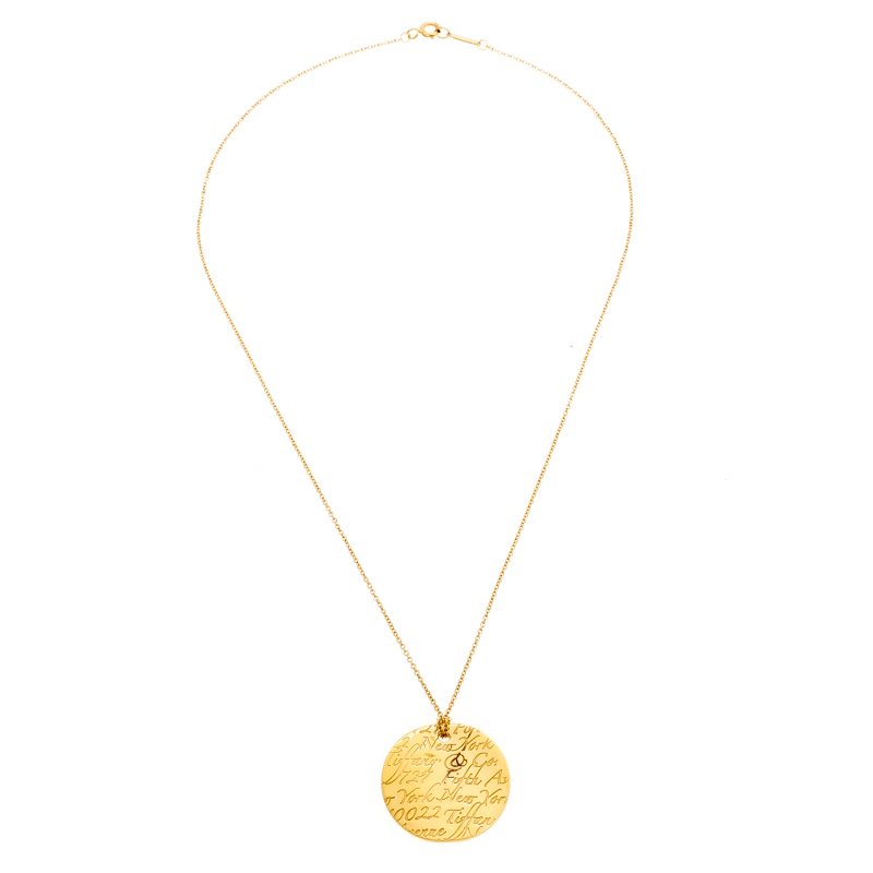 

Tiffany & Co. Tiffany Notes Engraved 18k Yellow Gold Round Wave Pendant Necklace