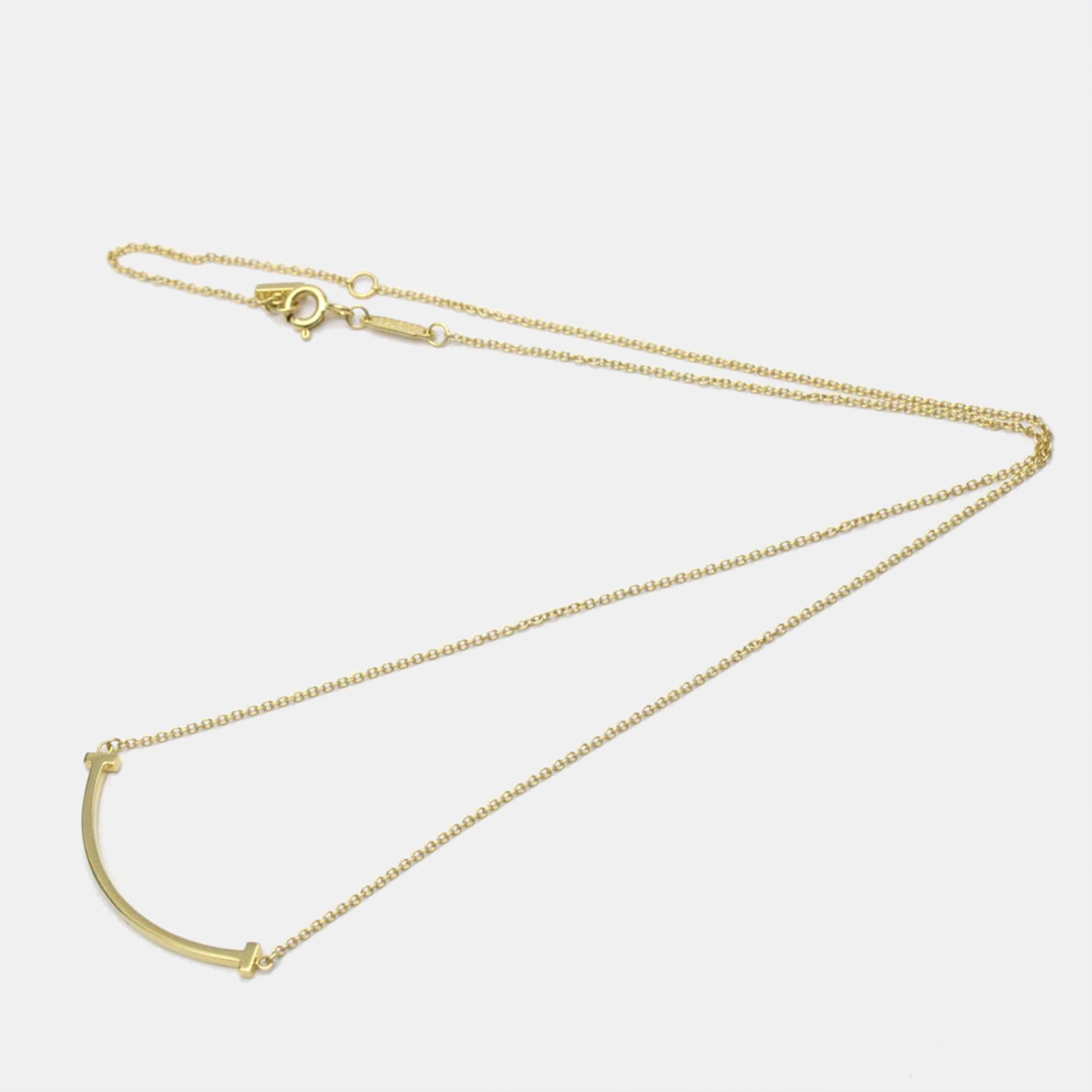 

Tiffany & Co. 18K Yellow Gold Small T Smile Pendant Necklace