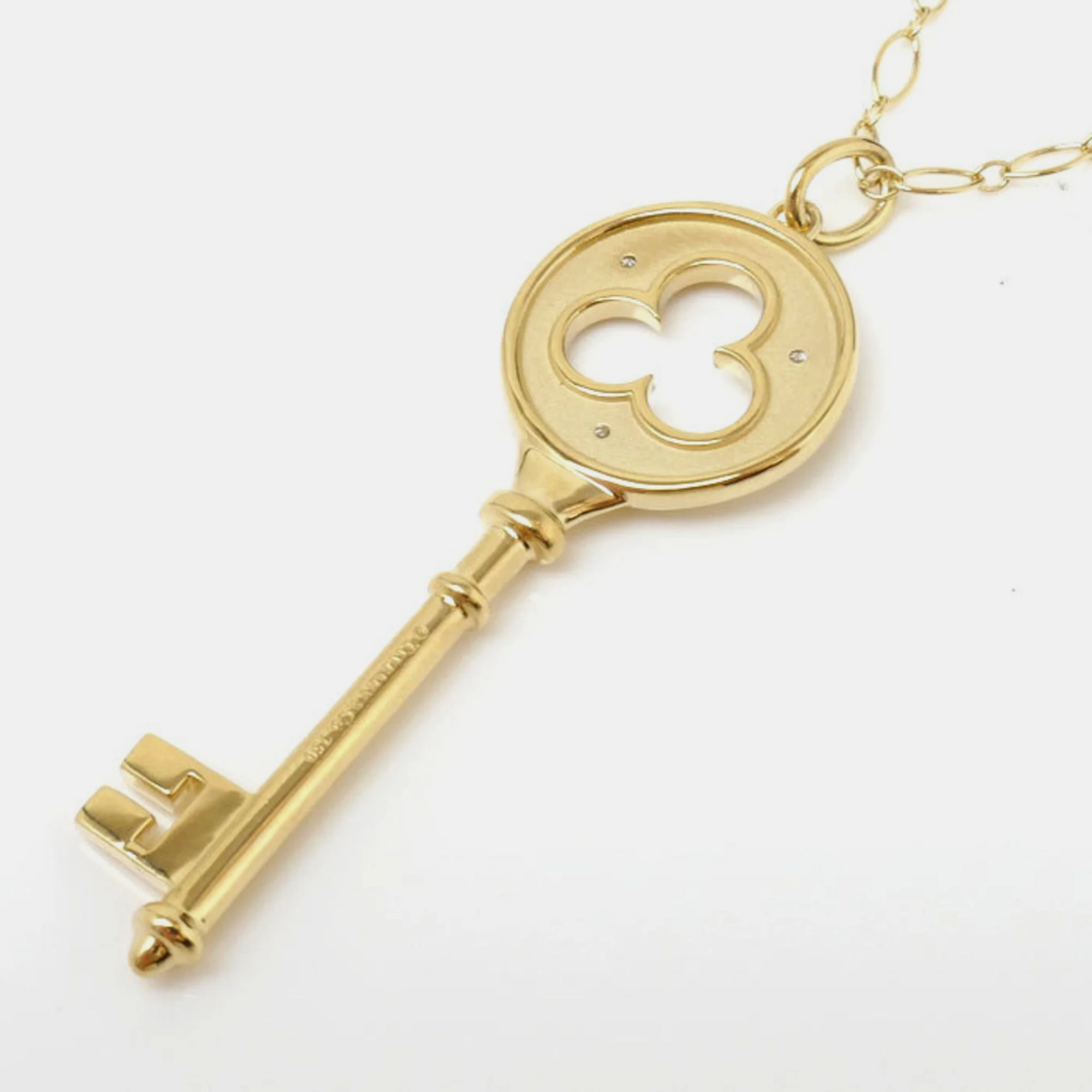 

Tiffany & Co. 18K Yellow Gold and Diamond Clover Key Pendant Necklace