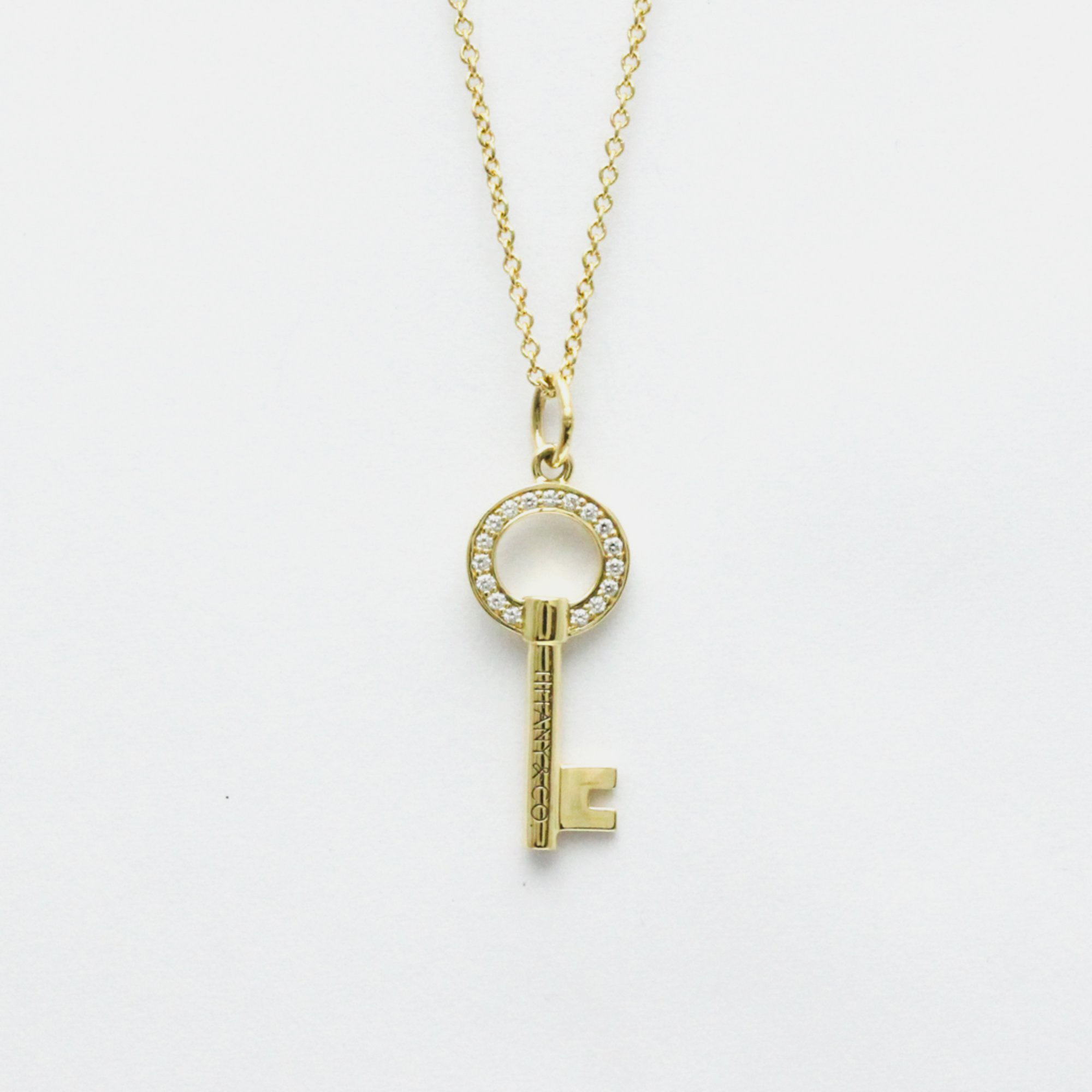 

Tiffany & Co. 18K Yellow Gold and Diamond Oval Key Pendant Necklace