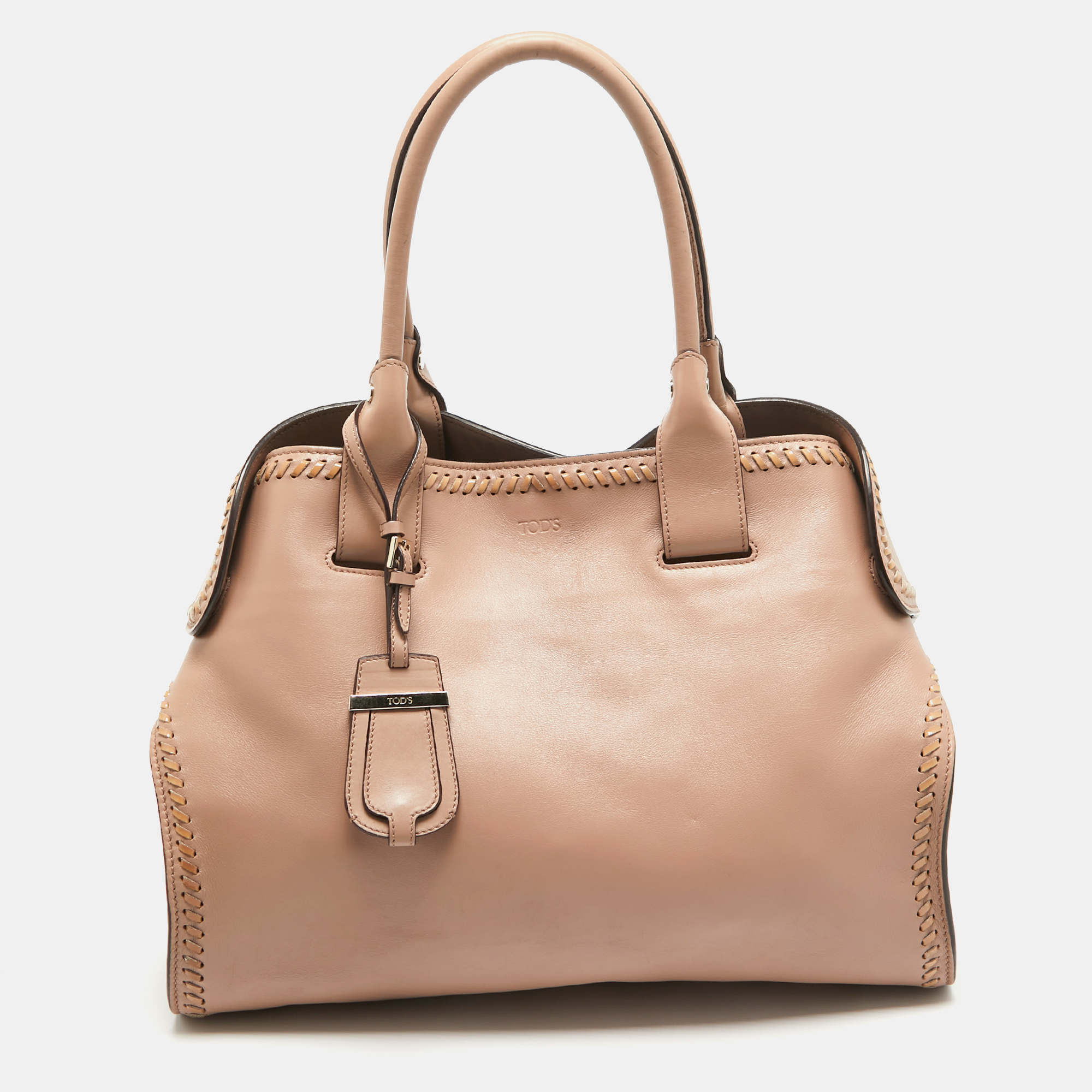 Be it your daily commute to work shopping sprees and vacations this Tods tote bag will never fail you. This designer creation is made to last and assist you in your fashion filled days.