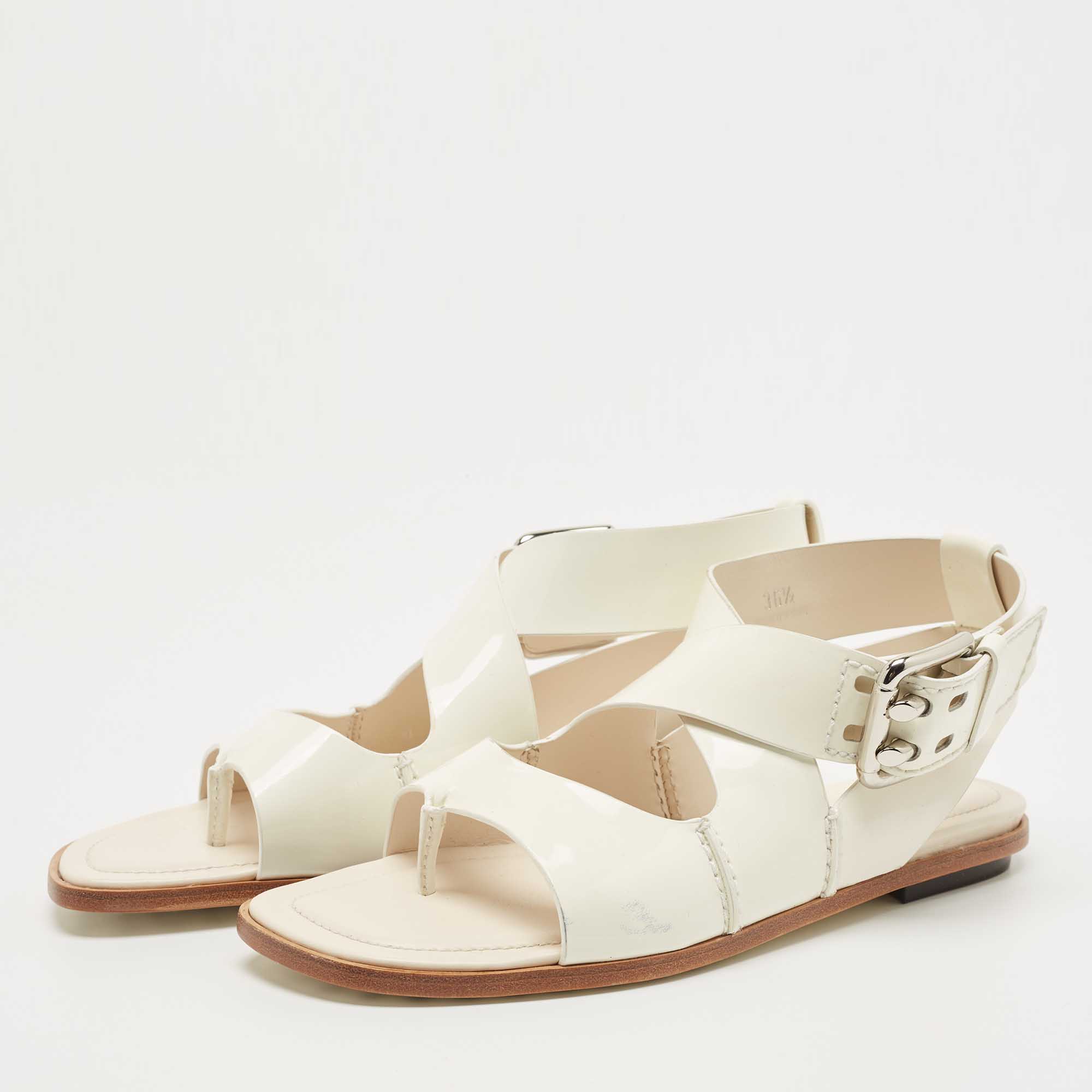 

Tod's Cream Patent Leather Cross Strap Flat Sandals Size