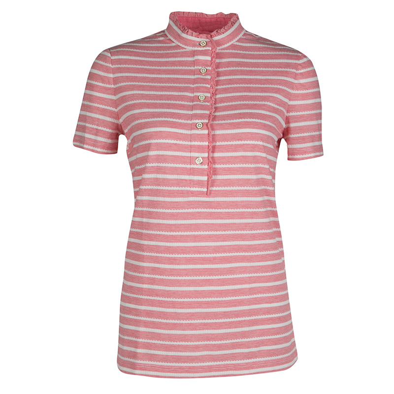 This Tory Burch creation features pink and white striped pattern and ruffle detail along the front buttons and high collar that add a feminine touch to the top making it a pretty piece to flaunt on casual outings. Finished with short sleeves the top will look best when styled with your denim shorts and sliders.