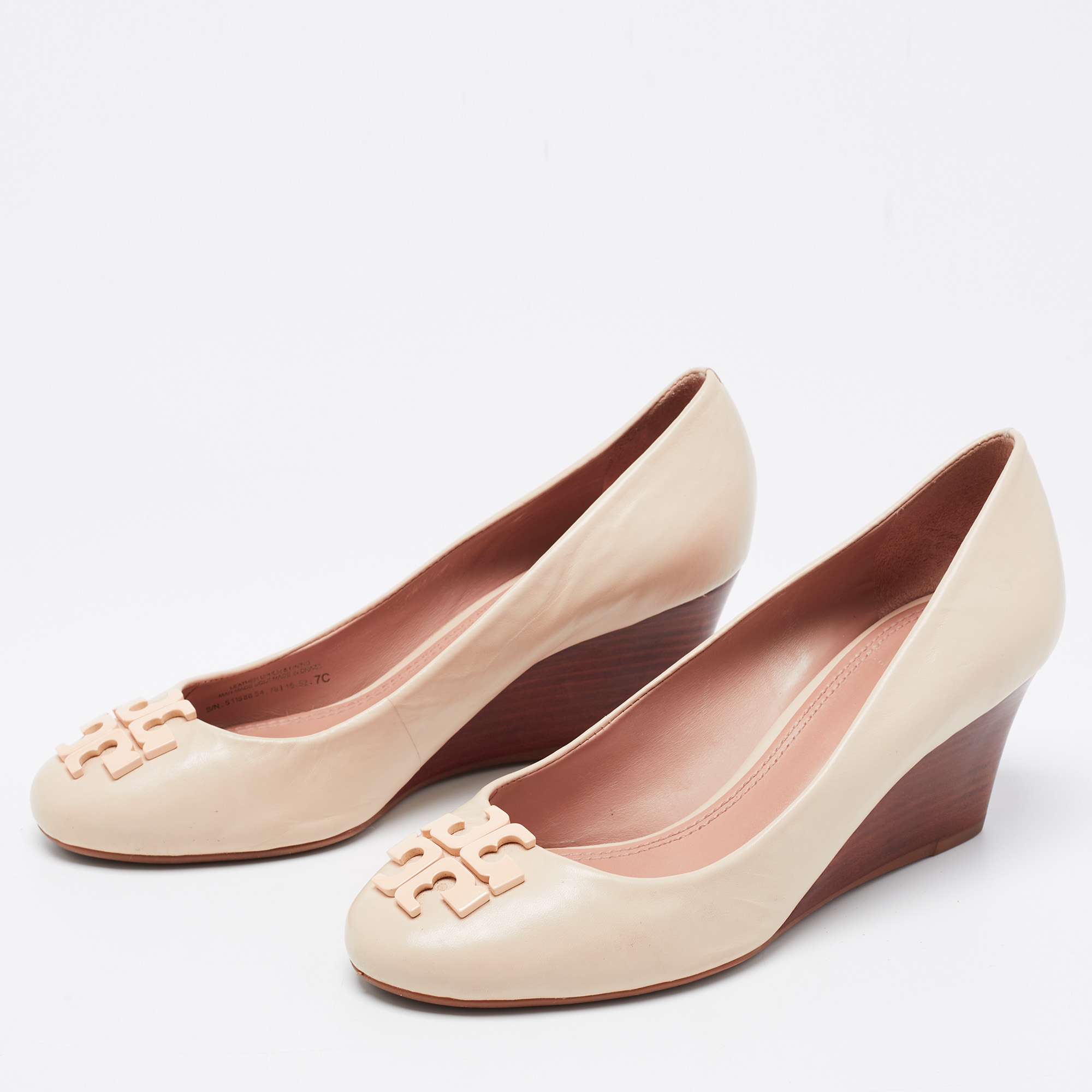 

Tory Burch Cream Leather Wedge Pumps Size