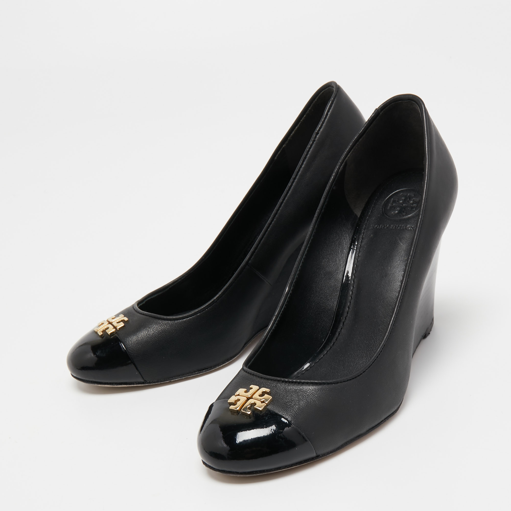 

Tory Burch Black Leather and Patent Cap Toe Reva Wedge Pumps Size