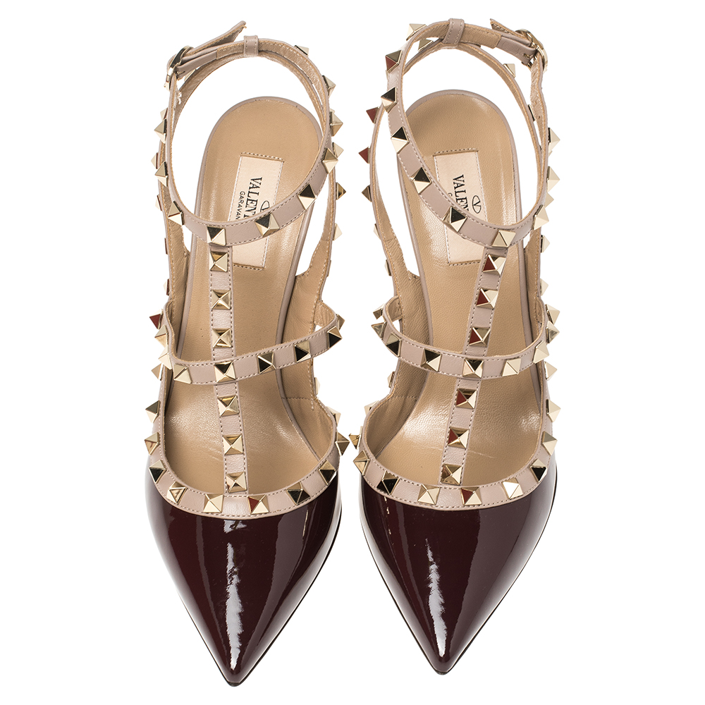 

Valentino Ruby Red/ Beige Patent Leather Rockstud Embellished Ankle Strap Pointed Toe Sandals Size, Burgundy