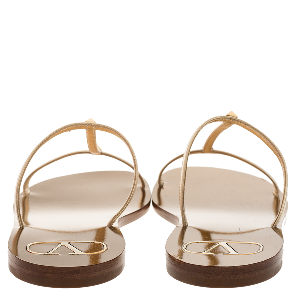 

Valentino Metallic Gold Leather T-strap Flat Slides Size