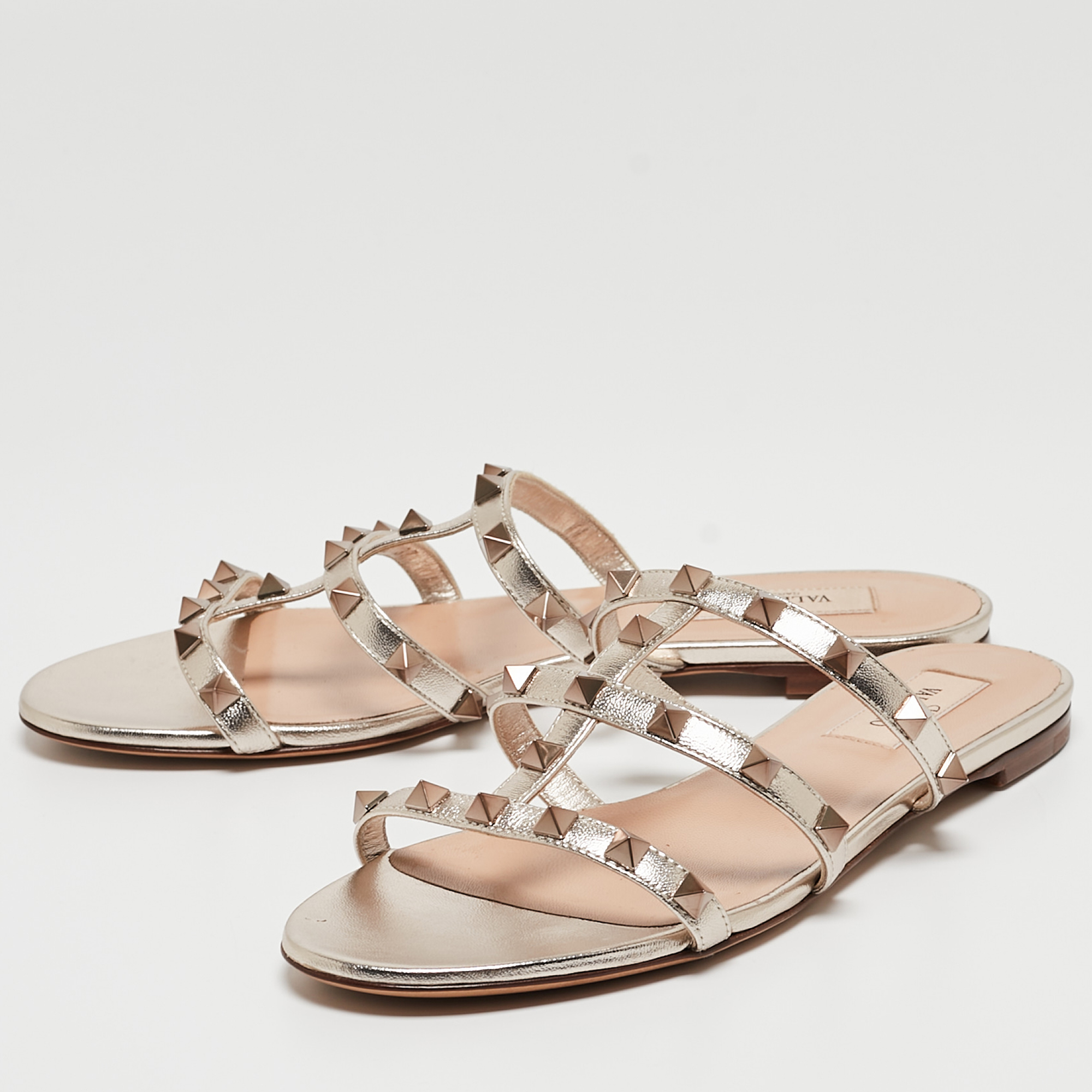 

Valentino Gold Foil Leather Rockstud Strappy Flat Sandals Size