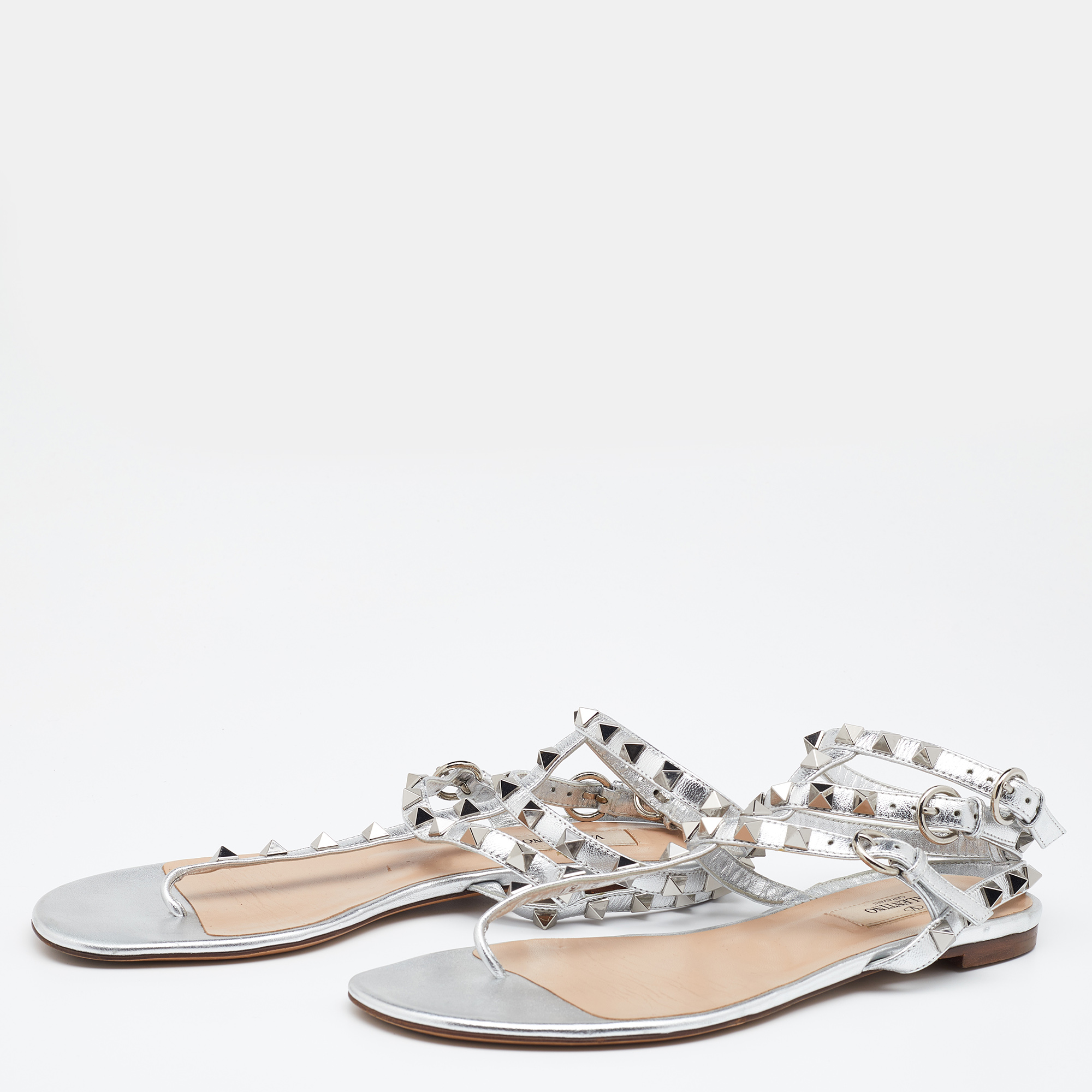 

Valentino Metallic Silver Leather Rockstud T Strap Flat Sandals Size