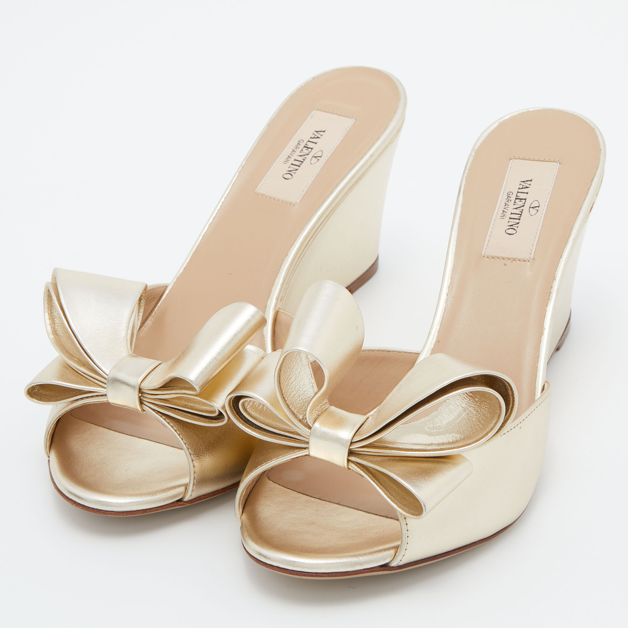 

Valentino Gold Leather Bow Wedge Sandals Size