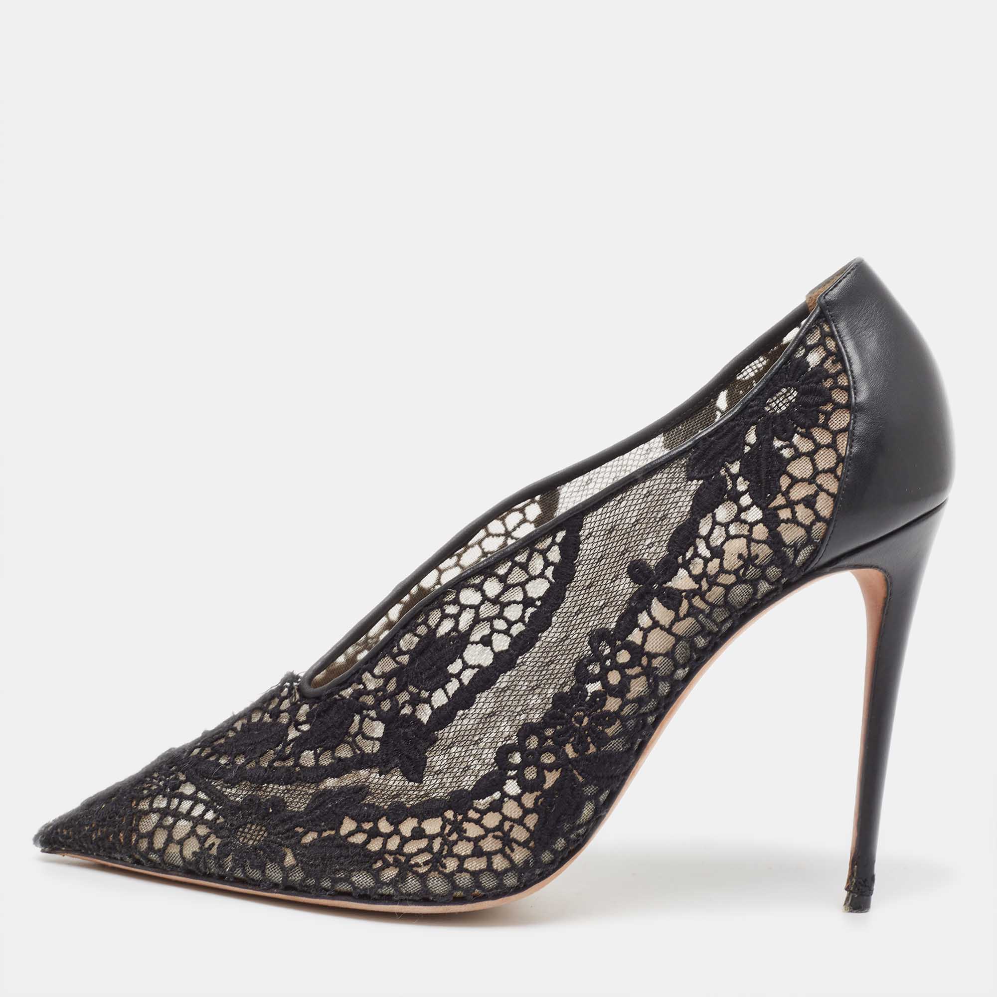 A feminine flair sleekness and a timeless appeal characterize these stunning pumps from Valentino. Made from dainty black lace and leather on the exterior they are adorned with pointed toes and raised on slender heels. Subtle and stylish these pumps will make you look elegant.