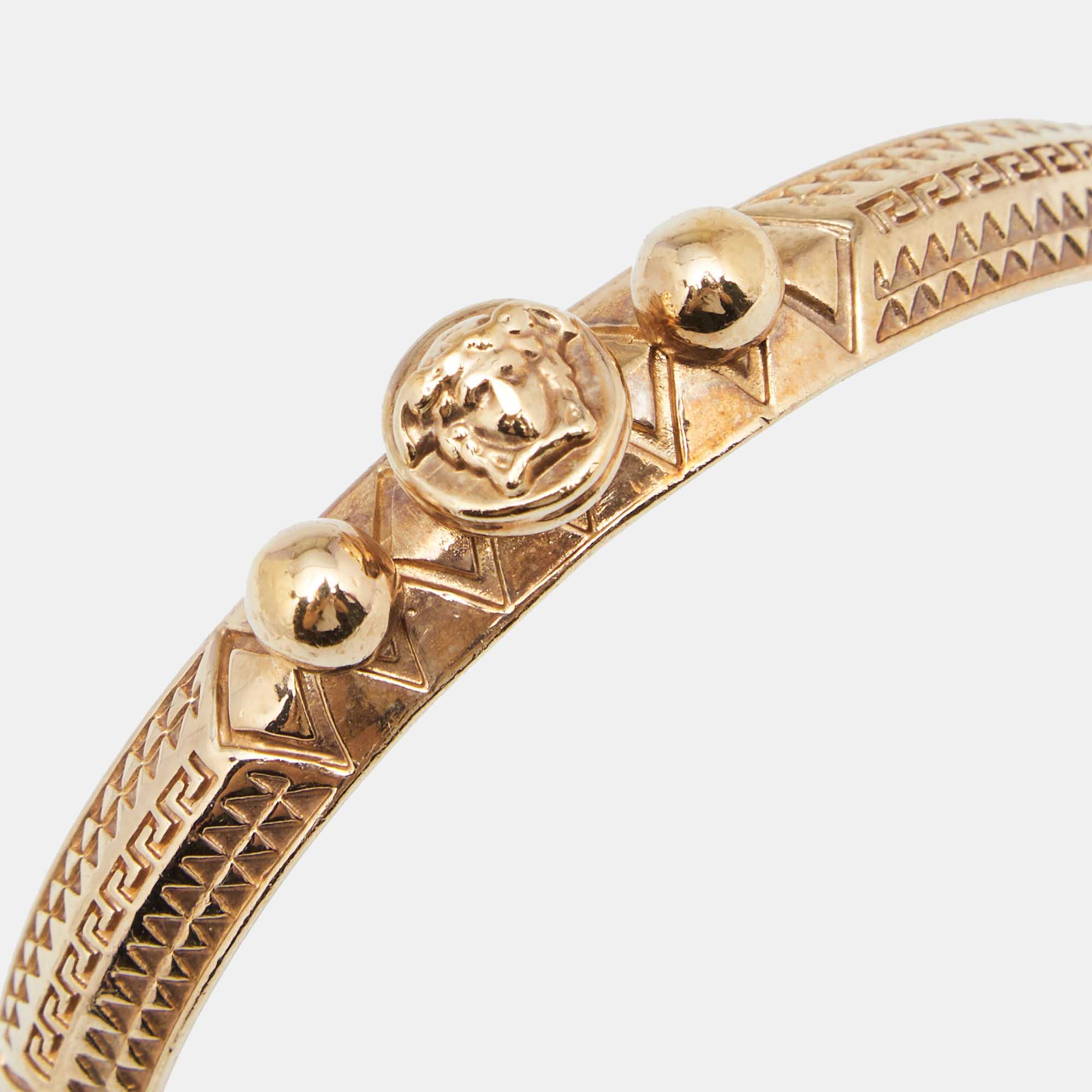 

Versace Gold Tone Medusa Tassel Charm Bangle Bracelet