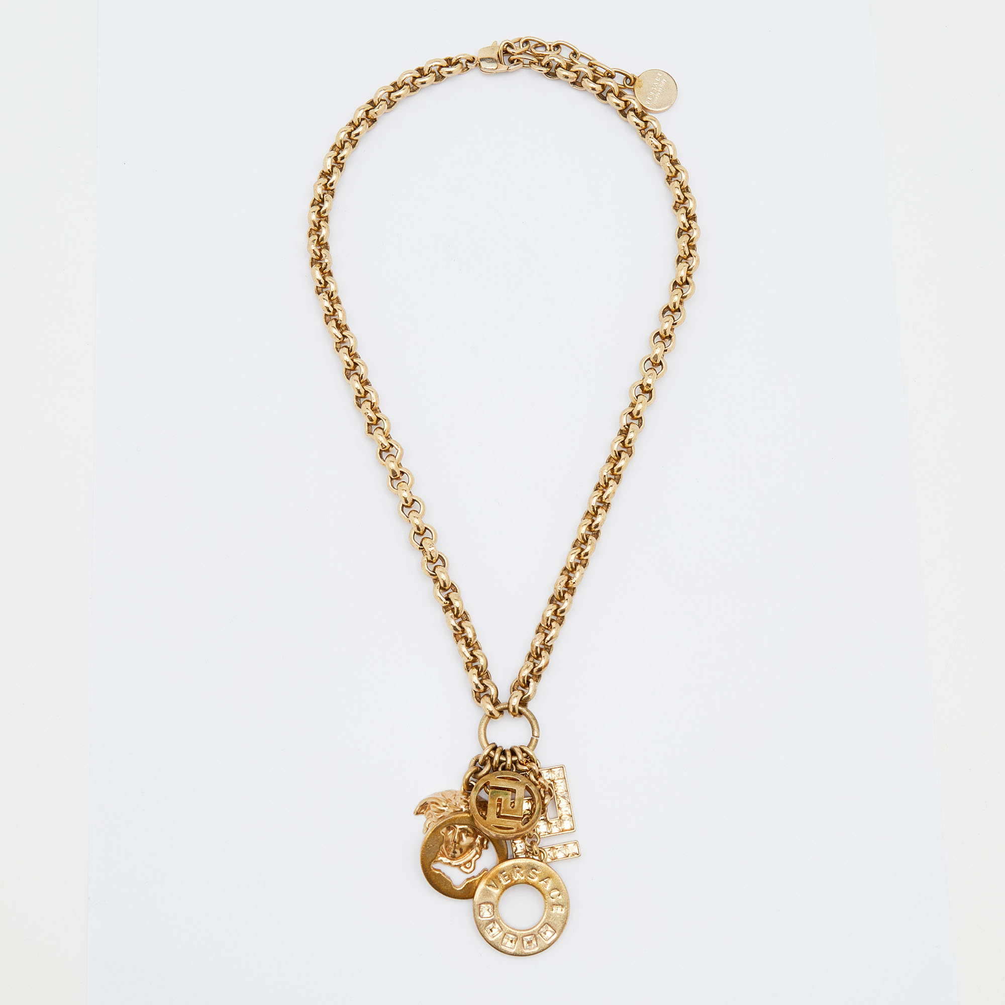 

Versace Medusa Gold Tone Multi Charm Pendant Necklace