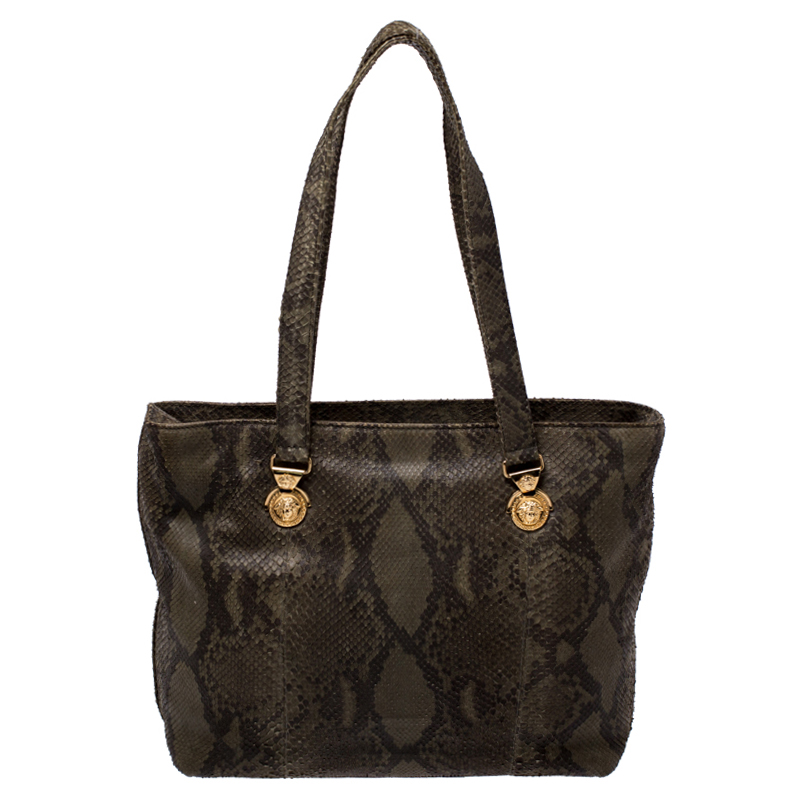 Highly durable and extremely fashionable this tote is from Versace. The bag comes made from python leather in a luxurious green shade and designed with their signature Medusa motifs. Further it is equipped with dual handles and a spacious interior that is secured by a zip top closure.