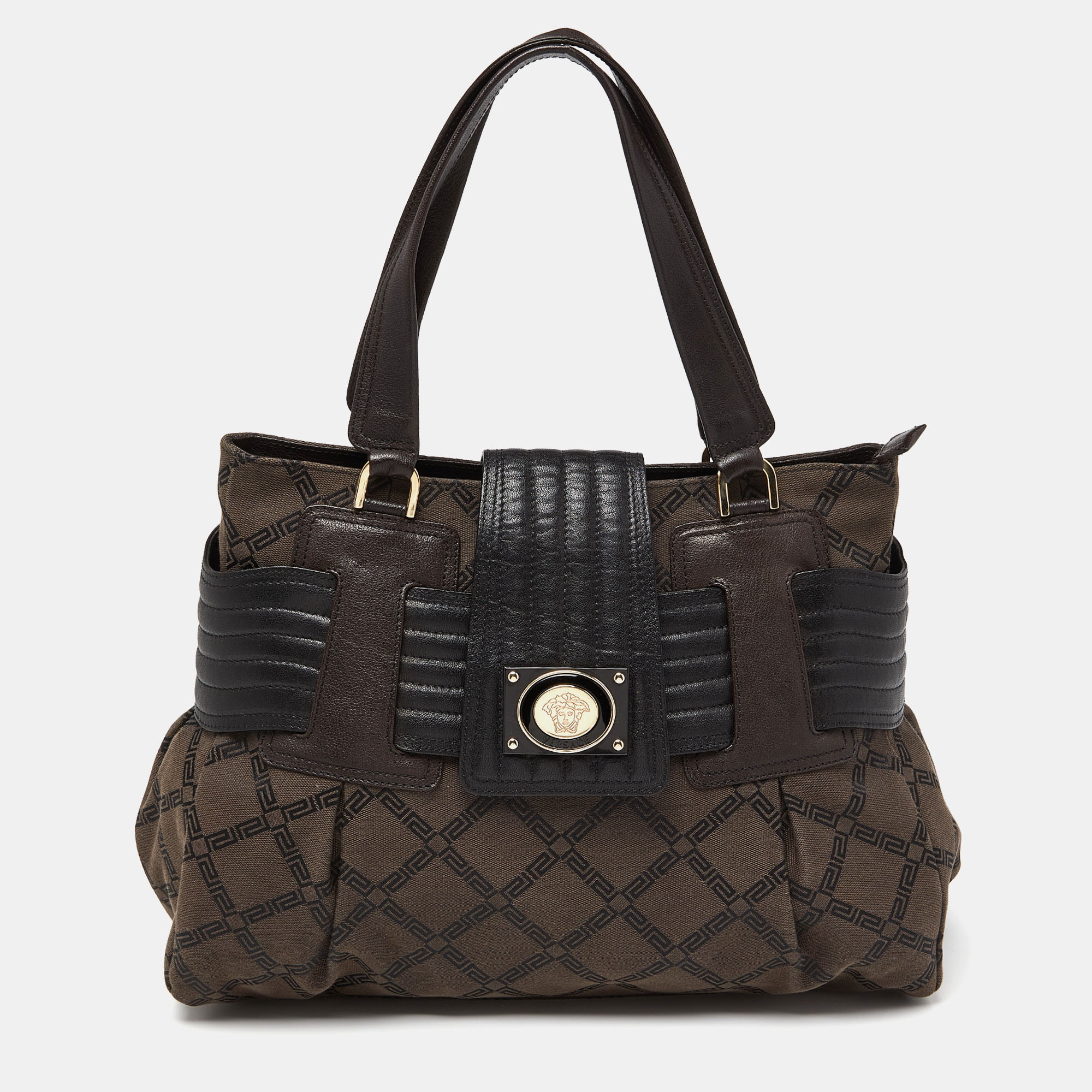 Ensure your days essentials are in order and your outfit is complete with this Versace tote. Crafted using Monogram fabric and leather the bag has two handles the Medusa logo on the front and a satin lined interior.
