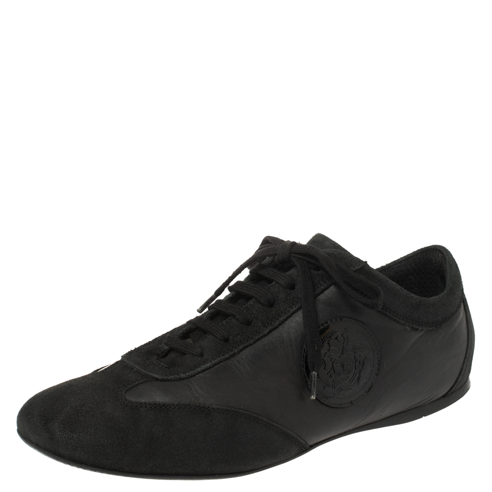 Make these stylish sneakers made from suede and leather yours this season. The trendy and chic sneakers from Versace will lift up your style in an effortless way. They come in black featuring lace up vamps the Medusa motif on the sides and durable rubber soles.