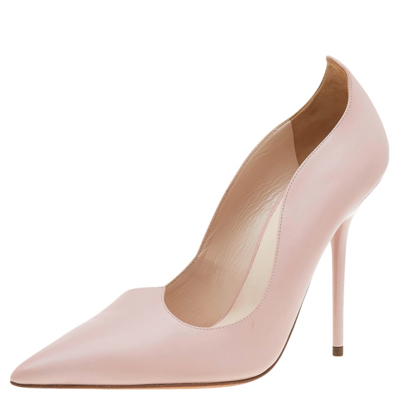 This Versace pair of pumps is a perfect example of fashion with function. Covered from leather in a pink hue it features silver tone hardware and pointed toes. Balanced on 12cm heels it will definitely lift your fashion spirits.