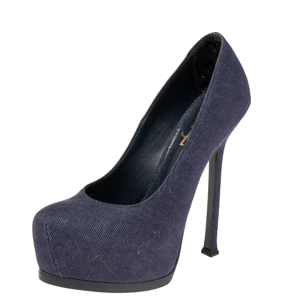 Fashionable and chic these Tribtoo pumps from Saint Laurent will cut an alluring silhouette from day to night. Crafted from denim fabric the pumps have a blue shade concealed platforms and 14 cm heels.