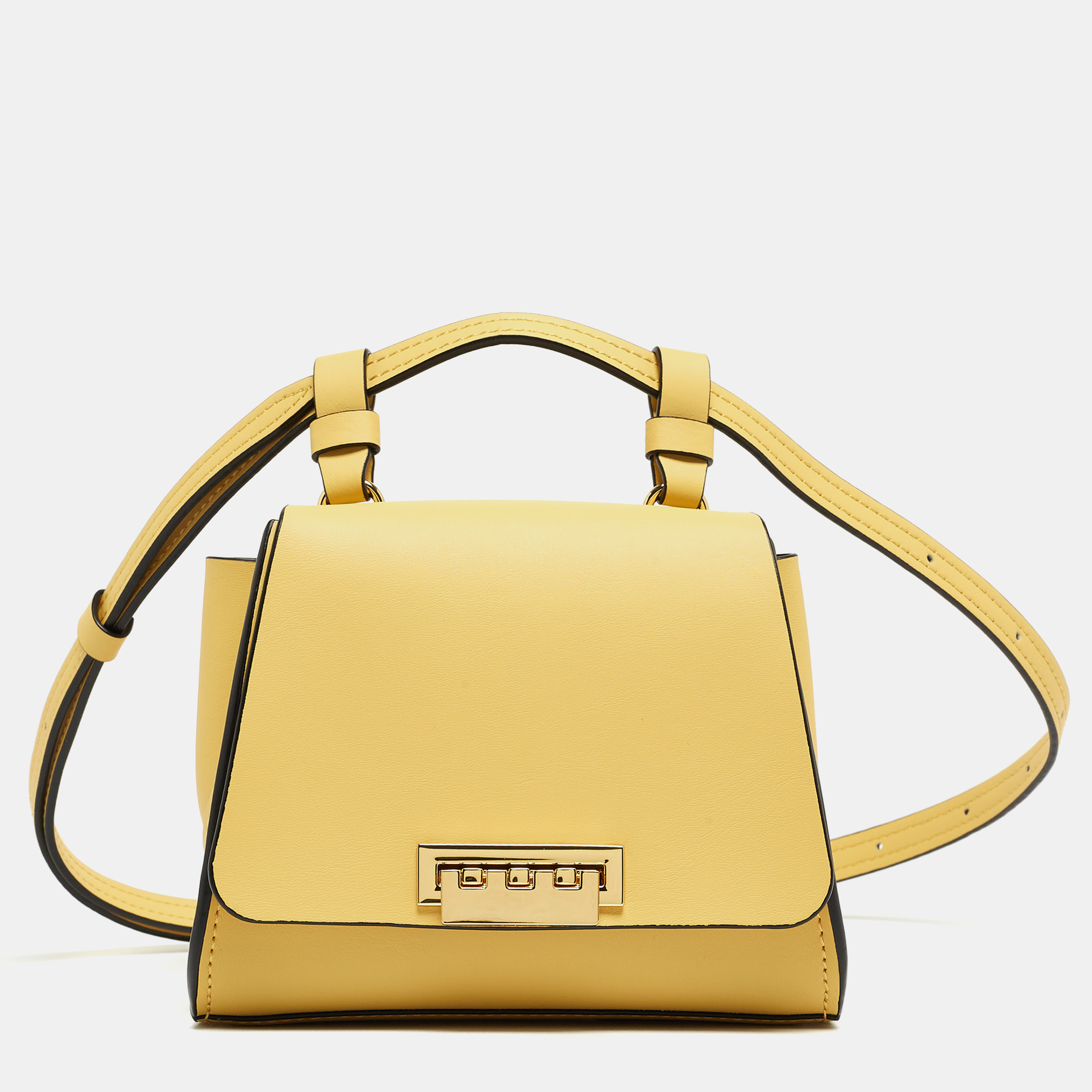 Designed by Zac Posen this light yellow leather bag is a fine balance of sophistication and utility. It has a flap style a top handle shoulder strap winged gussets and a leather interior. Fall in love instantly with this gorgeous mini Eartha by Zac Posen.