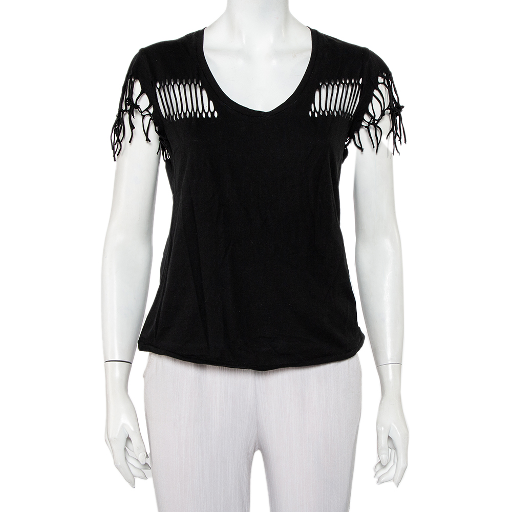 An edgy take on a simple T shirt this Zadig and Voltaire creation is for the fierce hearted women out there. It has been crafted from black hued cotton. This Wanda Fringes T shirt is styled with a scoop neckline short sleeves and cut ut detailing along the front sleeves and back.